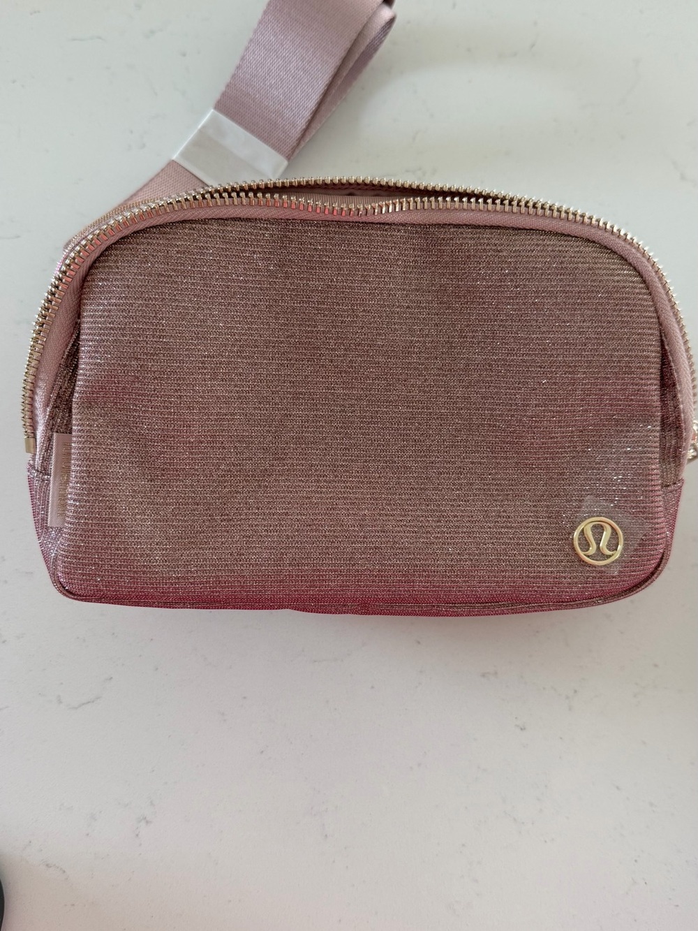 Lululemon Everywhere Belt Bag in a shimmering pink NWT